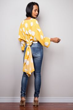 "Yellow Boho Kaftan top | Cotton Tunic top | polka dot beachwear tunic | Short front poncho top dress | blouse top | poncho top, beach cover up, summer tunic dress Produced by NUICHAN PRODUCT SIZE : One Size Fits Most These are the exact measurements from the dress, measured whilst laying flat >> * Chest : up to 52\" * Waist : 50\" * Sleeve length from neckline to hem : 21\" * Length (front part) : 24.5\" * Length (back) 52\" NOTE : * Model chest : 32\", waist : 24\" hips : 35\" * Combined Versatile Non-stretch Summer Blouse, Long Sleeve Polka Dot Blouse For Summer, Casual Wrap Blouse For Beach, Casual Beach Wrap Blouse, Non-stretch Beach Blouse, Trendy Polka Dot Tops For Summer, Chic Asymmetrical Blouse For Beach, Yellow Tops With Asymmetrical Hem For Spring, Spring Yellow Tops With Asymmetrical Hem