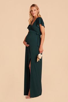 a pregnant woman in a green dress