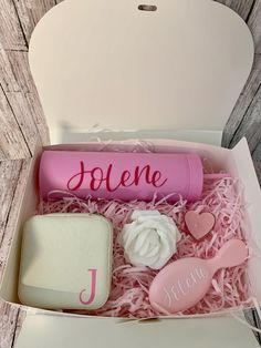 a pink box with personalized items in it