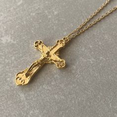 CROSS NECKLACE Stainless steel chain is used in this necklace. The pendant is 14K Gold plated. It is resistant to tarnishing. For other types of pilgrimage, please visit our shop! ☆ Delivery in 1-3 working days! ☆ We update the stock amount according to the custom of stones . If you contact us in case of bulk purchase or no stock, we will reply quickly.( stock is 100 pcs) If you are thinking of purchasing a product that will make you feel good, but if you have any questions about the product, we will help you. After purchasing the product, we follow your order closely and inform you in the process until the product reaches you. The product has arrived! It's yours now ! If there are ever any issues with the jewelry, please feel free to contact us with your concerns. Our team is dedicated to Gold Plated Crucifix Necklace, Gold Chain Necklace With Cross Pendant For Gift, Gold Metal Cross Necklace With Clavicle Chain, Gold Plated Crucifix Necklace Tarnish Resistant, Gold Plated Tarnish Resistant Crucifix Necklace, Gold-plated Tarnish-resistant Crucifix Necklace, Gold Charm Necklaces With Cross Pendant And Adjustable Chain, Gold Cross Pendant Charm Necklace With Adjustable Chain, Gold Charm Necklace With Cross Pendant And Adjustable Chain