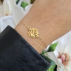 Minimal and Simplistic Style!A meaningful gold lotus flower bloom sits in the center with sparkling Gold Filled chain encircling the wrist. Solid lobster clasp. Your choice of length or you can order it to be adjustable making it easier for gift giving.Just like the Lotus, we too have the ability to rise from the mud, bloom out of the darkness and radiate into the world.All jewelry includes complimentary gift packaging.At Fabulous Creations, all our jewelry is handcrafted in the USA, inspired by