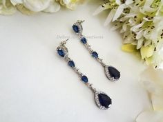 "Same Style Earrings-Shorter Length: https://www.etsy.com/listing/1302867248 Matching Bracelet: https://www.etsy.com/listing/1353304140 https://www.etsy.com/listing/1456206829 Matching Hair Pin: https://www.etsy.com/listing/880678156 Item #BRER4076 These Handmade, Original Design crystal earrings are comprised of Sapphire Cubic Zirconia Teardrop framed with round CZ crystals, Cubic Zirconia Teardrop Round/Diamond Connectors and Gorgeous Sapphire Cubic Zirconia Inverted Teardrop Ear Stud Posts al Blue Drop Bridal Earrings For Party, Blue Dangle Bridal Earrings For Formal Occasions, Elegant Blue Drop Chandelier Earrings, Formal Blue Dangle Bridal Earrings, Blue Drop Bridal Earrings, Blue Drop Bridal Earrings For Wedding, Blue Drop Earrings For Wedding, Blue Teardrop Chandelier Earrings For Wedding, Blue Teardrop Chandelier Earrings For Anniversary