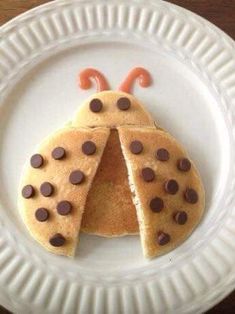 a white plate topped with pancakes covered in chocolate chips