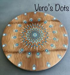 a wooden plate with blue and white designs on it