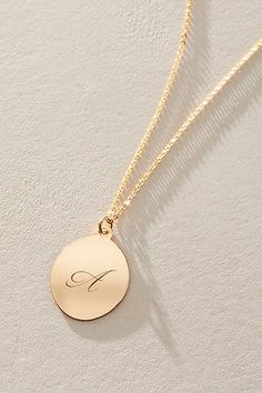 Just as effortless as it is elegant, this stunning necklace features an oval pendant with gorgeous cursive engraved initial for the ideal finishing touch. * 14k Gold Filled chain * Personalized, laser engraved, 14k Gold Filled 17x22mm oval pendant * Length: 20" * 5 days of production | Set & Stones Personalized Amelia Necklace at Free People in Gold Elegant Monogram Charm Necklace For Personalized Gift, Elegant Monogram Charm Necklace, Elegant Initial Necklace With Monogram Round Pendant, Elegant Sterling Silver Monogram Charm Necklace, Personalized Oval Yellow Gold Necklace, Elegant Round Monogram Name Necklace, Elegant Initial Pendant Necklace With Polished Finish, Elegant Polished Initial Pendant Necklace, Gold Oval Pendant With Initials Jewelry