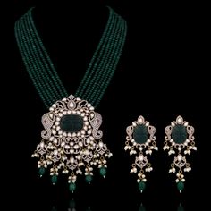 A pure masterpiece of glitz, grace, and elegance - perfect to enhance your festive attire! Make a statement and ethereal impression with an alluring ensemble embellished with CZ and carved stones, vintage bead work, pearl moti detailing and elephant motifs adding a festive charm to uplift your look. The set includes a mala and a pair of matching earrings. Approximate mala length is 12" & earrings length is 3.5". Gold-plated on high-quality brass as base metal. Aarti Set (White) is in-stock & rea Hand Embellished Traditional Kundan Wear, Traditional Anarkali Set With Pearl Embroidery For Designer Wear, Elegant Kundan Sets With Intricate Design, Traditional Kundan Hand Embellished Sets, Elegant Hand Embellished Traditional Wear For Diwali, Traditional Kundan Hand-embellished Sets, Elegant Hand-embellished Traditional Wear For Diwali, Elegant Kundan Sets With Meenakari Detailing, Elegant Kundan Sets For Diwali