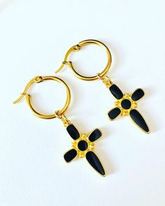 - Stainless steel hoop earrings , black cross earrings, the cross charm is 24K gold plated - The diameter of earrings is 2 cm (0,8 inches), charm length is 3.5 cm (1,4 inches) - Colors may appear slightly different on screen due to differences in resolution, brightness, and contrast JEWELRY CARE - Keep jewelry dry - Take it off before taking shower, bath, swimming or exercising - Makeup, perfume, hairspray apply before wearing jewelry - Store your jewelry somewhere dry, not in the bathroom Handm Contrast Jewelry, Black Cross Earrings, Earrings Cross, Wearing Jewelry, Black Cross, Cross Earrings, Black Earrings, Earrings Black, Cross Charms