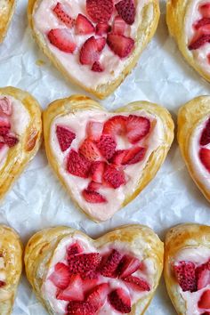 heart shaped pastries with strawberries on them