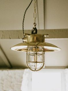 a light fixture hanging from the ceiling in a room