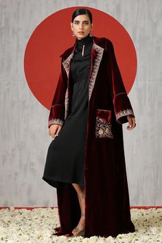 Black silk solid dress with turtle neckline. Paired with maroon long sleeve velvet front pocket jacket with Kashmiri tilla embroidery. - Aza Fashions Red Velvet Outerwear For Winter, Red Velvet Winter Outerwear, Elegant Long Sleeve Red Abaya, Elegant Red Long Sleeve Abaya, Traditional Velvet Long Sleeve Outerwear, Traditional Long Sleeve Velvet Outerwear, Elegant Red Embroidered Abaya, Traditional Evening Outerwear For Winter, Elegant Long Embroidered Outerwear