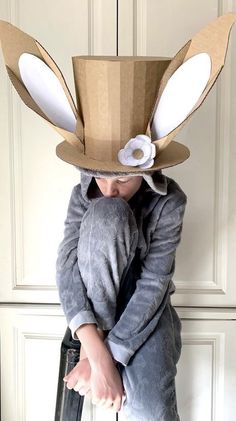 a young child wearing a rabbit costume