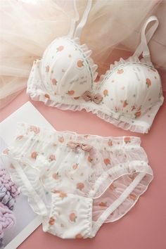 Indulge in the playful charm of the Sweet Delights Cotton Bra Set from StylinArts. This adorable lingerie set features a fun and whimsical pattern, available in strawberry, radish, and peach prints, perfect for adding a touch of sweetness to your everyday wear. The bra is designed with a soft steel ring for upper support, ensuring both comfort and style. Complemented by a matching pair of panties, this set is crafted from high-quality cotton, providing a soft and breathable feel. The bow detail Bra Panty Set, Bra Design Fashion, Coquette Bra, Bow Bra, Bra And Panties Set, Coquette Dress, Cotton Bra, Panty Style, Cute Bras