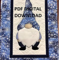 a blue and white quilted book cover with an image of a gnome