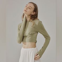 Nwt Long Sleeve Solid Fitted Crop Top (Eagle) - Nap Loungewear This Ultra Soft, Slim Fit, Crop Top Features A Wide Round Front Neckline With A Low Scoop/Open Back. It Also Has A Unique Elastic Band Around The Back To Secure The Top In Place. 'Eagle' Color Is A Pretty Neutral Olive/Muted Green Hue. Cute For Exercise Or Casual Wear! Size Small New With Tags 35.6% Viscose, 26.8% Acrylic, 26.8%Cotton, 10.8% Spandex Please See Actual Product Photos For Garment Color And Detail, Which May Vary Slightl Fitted Khaki Tops With Crew Neck, Fitted Khaki Crew Neck Tops, Stretch Khaki Tops For Loungewear, Stretch Khaki Long Sleeve Top, Beige Fitted Tops For Loungewear, Spring Khaki Tops For Loungewear, Versatile Long Sleeve Beige Top, Khaki Tops For Fall Loungewear, Versatile Beige Long Sleeve Tops