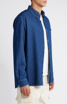 This timeless button-down shirt is made from washed organic-cotton denim and finished with a patch pocket. Front button closure Button-down collar Long sleeves with button cuffs Chest patch pocket 100% organic cotton Machine wash, line dry Imported