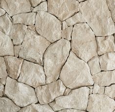 a stone wall that looks like it has been made out of rock and is beige