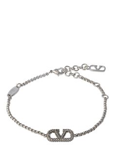 Find VALENTINO Vlogo Signature Crystal Bracelet on Editorialist. Maximum length: 21cm. Minimum length: 18cm. Silver-plated brass. Crystal. Logo detail. Adjustable clasp closure with logo detail Luxury Silver Jewelry With Metal Logo, Luxury Chain Bracelet With Logo Charm, Luxury Jewelry With Metal Logo, Designer Jewelry Bracelet With Logo Charm, Designer Logo Charm Bracelet Jewelry, Designer Metal Bracelets With Logo Charm, Silver Metal Jewelry With Logo, Silver Metal Jewelry With Metal Logo, Designer Formal Jewelry With Metal Logo