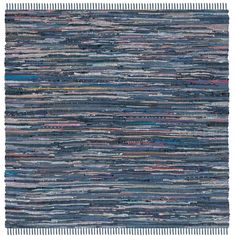 a blue rug with many different colored strips on it