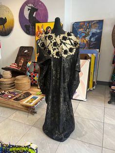 Womens new s kampala/ kaftan/ boubou dress gold and black lace patterned featuring flower embellishments.  size 12-20 uk very big and roomy inside.  The dress can be take up with wonder web if to tall. Great  dress very eye catching.  Will be steamed before the dress is sent.  This is a fair trade item from And hand made in  Nigeria.  We would like to thank you in advance for supporting are small business.  Happy shopping  Therapace Black Long Sleeve Dress In Ankara Fabric, Lace Dress Nigeria, Traditional Black Dress With Kimono Sleeves, Traditional Black Free Size Kaftan, Black Free Size Dress With Kimono Sleeves, Black And Gold Lace Dress, Boubou Dress, Gold Lace Dress, Gold Lace Dresses