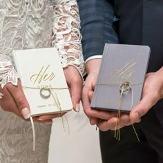 two people holding wedding gifts in their hands