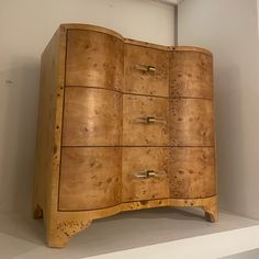 a large wooden cabinet sitting on top of a white shelf