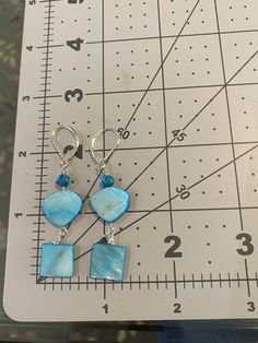 Turquoise colored shapes make up this cute necklace and dangle earring set. Pearl Necklace And Earring Set, Mother Of Pearl Necklace, Necklace And Earring Set, Cute Necklace, Color Shapes, Turquoise Color, Wire Wrapped Jewelry, Earring Set, Mother Of Pearl