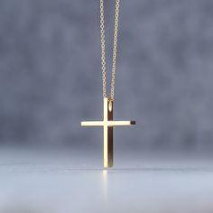 Minimal solid gold handmade cross necklace, unisex cross, great for men and women alike. Available in 14k yellow and 14k white gold, please make your choice from the drop down menu. This pendant has a shiny/polished finish. Size: 1,9 cm / 0.8 inches long and 1.5cm / 0,6 inches wide Material: 14k solid yellow gold, 14k solid white gold You can choose the charm with a 14k solid gold chain or without a chain. Perfect Birthday gift, Baptism gift or for any other special occasion. Comes in gift box. Minimalist Cross Pendant Necklace As Gift, Minimalist Cross Pendant Jewelry Gift, Gold Minimalist Tarnish Resistant Cross Necklace, Minimalist Cross Necklace Tarnish Resistant, Minimalist Gold Crucifix Jewelry, Simple Yellow Gold Cross Necklace, Minimalist 14k Gold Cross Pendant Necklace, Minimalist Gold Cross Necklace As Gift, Minimalist Yellow Gold Cross Pendant Jewelry