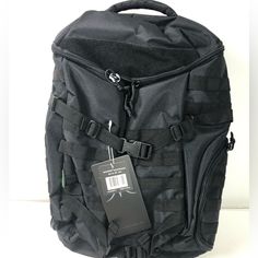 a back pack with a tag attached to it's front and side zippers