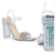 A Clear Block Heel And Sparkling Embellishment Bring A Glamorous Energy To This Runway-Ready Sandal. 3.75" Heel Adjustable Ankle Strap With Buckle Closure Cushioned Insole Open Toe Slingback Block Heel Lucite Upper/Manmade Sole Imported Clear Open Toe Sandals For Wedding, Glamorous Summer Wedding Heels, Clear Block Heel Sandals For Party, Clear Block Heel Party Shoes, Clear Block Heel Party Heels, Clear Ankle Strap Heels For Party, Crystal-embellished Open Toe Heels For Prom, Synthetic Wedding Shoes With Padded Heel, Clear Ankle Strap Sandals For Party