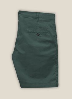 Bemuse yourself with classic charm and modern grace in our Gallo Green Cotton Stretch Chino Shorts. Meticulously crafted from the finest premium cotton. The sumptuous green hue imparts an air of exquisite nobility that is both timeless and contemporary.   This classic design makes it a versatile addition to any wardrobe making it perfect for a range of occasions, from high-profile formal gatherings to chic, upscale casual events.  Look features a front cross pocket, and two welted back pockets with a button.   Click 'Customize Now' to modify the look if needed. Elegant Cotton Shorts With Pockets, Elegant Cotton Bermuda Shorts For Spring, Khaki Cotton Bermuda Shorts, Green Cotton Pants With Welt Pockets, Classic Green Cotton Pants, Summer Cotton Bottoms With Welt Pockets, Olive Cotton Spring Bottoms, Spring Olive Cotton Bottoms, Cotton Bermuda Shorts With Welt Pockets