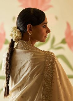 This beautiful ivory and gold Chanderi silk Kurta set exudes grace and elegance, featuring intricate embroidery adorned with sequins, pearls, and cutdana work. The anarkali top has a regal flair with delicate embellishments along the neckline, sleeves, and hemline, adding a luxurious touch to the traditional design. The flowy silhouette is paired with matching straight-cut trousers, offering both comfort and style. Completing the ensemble is a matching ivory dupatta embellished with gold embroid Anarkali Cream Lehenga With Gota Work, Beige Anarkali Set With Zari Work, Floor-length Cream Chanderi Traditional Wear, Festive Beige Sharara With Gota Work, Semi-stitched Beige Anarkali Set With Traditional Drape, Bollywood Beige Anarkali Set With Traditional Drape, Cream Silk Anarkali Set, Beige Semi-stitched Anarkali Set With Traditional Drape, Beige Bollywood Anarkali Set With Traditional Drape