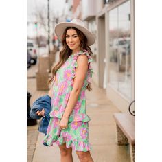 If you are a person who loves bold clothing, this dress is for you! The bright colors paired with the floral print and ruffles makes such a fun, unique look! Self & Lining: 100% Polyester Hand Wash Cold. Do Not Bleach. Low Iron. Do Not Dry Clean. Line Dry. Pink Ruffle Sleeve Dress For Spring, Pink Ruffle Dress For Spring Garden Party, Casual Floral Print Tiered Ruffle Dress, Casual Tiered Ruffle Dress With Floral Print, Casual Tiered Floral Print Ruffle Dress, Casual Tiered Ruffle Floral Dress, Spring Ruffle Dress For Day Out, Casual Tiered Floral Dress With Ruffles, Floral Print Ruffle Sundress For Garden Party