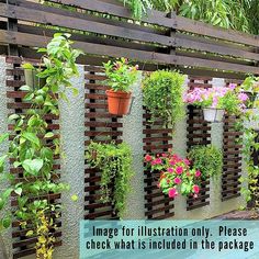 a wooden fence with potted plants and flowers hanging on it's side wall