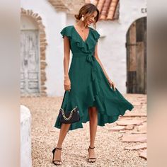 New Chic Ruffle Wrap Tie Midi Dress * Wrap Deep V Neckline * Ruffle Trim * High Waist * Belted Tie Waist * A Line Flare High Low Skirt * Ruffle Hem * Short Flutter Sleeve * Side Zip *Approximate Unstretched Measurements* Small (4) * Bust 35.25" * Waist 28.5" * Length 47" Medium (6) * Bust 37" * Waist 30" * Length 47.5" Large (8/10)* Bust 39.25" * Waist 32.5" * Length 48.25" Xl (12) * Bust 41.5" * Waist 35" * Length 49" On Order* Will Ship In 5-10 Days Fabric : Soft Flowy Poly Color : Dark Green Cottage Core Blouse, Preppy Autumn, Bridal Photo Shoot, Tied Dress, Green Wrap Dress, Aesthetic Party, Belted Wrap Dress, Skirt Ruffle, Green Wrap