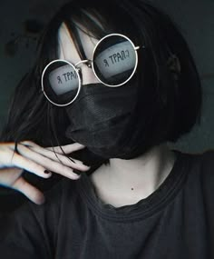 a woman wearing glasses with the words chater on them in front of her face