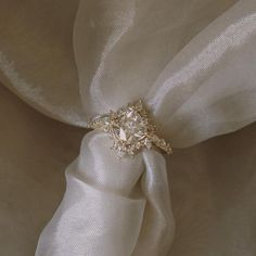 a white cloth with a ring on it