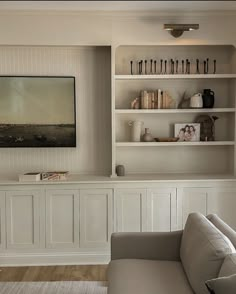 a living room with bookshelves and a couch