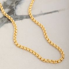 Meticulously crafted from solid 14 karat yellow gold, the 3mm Round Box Chain exudes timeless elegance and sophistication. This intricately crafted chain features a smooth design that enhances its natural luster, creating a captivating shine with every movement. Designed to be the perfect gold necklace for men, its solid and durable links promise long-lasting strength and comfortable wear for any occasion. Whether worn on its own or with a pendant, this chain's rounded design offers a refined to Gold Plated Box Chain Necklace For Anniversary, Anniversary Gold Plated Box Chain Necklace, Yellow Gold Round Chain Necklace With Box Chain, Gold Box Chain Necklace For Anniversary, Gold Plated Box Chain Necklace For Formal Occasions, Yellow Gold Chain Necklace With Solid Link Construction, 14k Yellow Gold Box Chain Necklace, Classic Gold Plated Box Chain Necklace, Classic Box Chain Necklace For Everyday Luxury