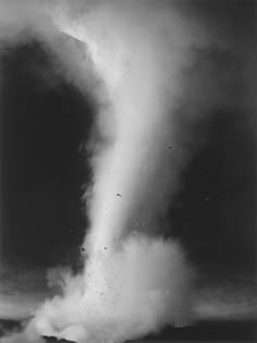 a black and white photo of a large cloud in the sky