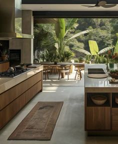 an open kitchen with wooden cabinets and counter tops