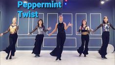 four women in black and gold outfits are dancing on a stage with the words peppermint twist above them