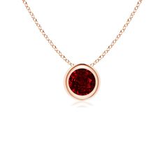 This classic solitaire ruby pendant's beautiful design makes the center stone appear like it's floating on the chain. The purplish red gem is secured in a bezel setting. Crafted in 14k rose gold, this dazzling round ruby pendant is simple yet gorgeous. Solitaire Pendant Necklace, Ruby Pendant, Solitaire Pendant, Fine Jewellery Necklace, Bezel Setting, The Chain, Birthstone, Beautiful Design, Gemstone Jewelry