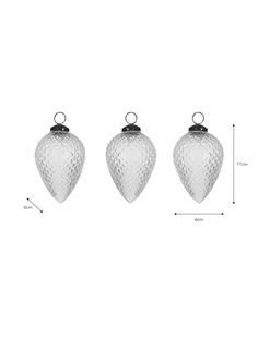 three glass christmas ornaments are shown with measurements