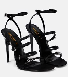 Find SAINT LAURENT Jerry Embellished Satin Sandals on Editorialist. Lining: leather. Upper: fabric. Sole: leather insole and sole. Toe shape: almond open toe. Comes with a box. Designer color name: Noir. Closure: buckle-fastening ankle strap. Made in Italy. Comes with dust bags.