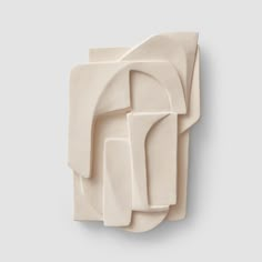 an abstract sculpture made out of white clay