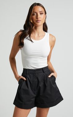 Add a touch of sophistication to your summer wardrobe with our Khaimy Shorts. These high-waisted, tailored shorts in classic black are the perfect addition to any casual ensemble. Made from 100% cotton, these shorts offer ultimate comfort and breathability for those warm days ahead. The cuffed hem adds a stylish twist to this timeless design, making them an essential piece for fashion-forward individuals like yourself. Whether you're heading out for brunch or lounging by the pool, our Khaimy Sho Tailored Shorts, Shorts Casual, Cuffed Shorts, The Pool, High Waisted Shorts, Summer Wardrobe, Short Outfits, Classic Black, Casual Style