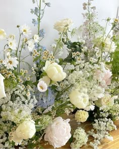 a bunch of flowers that are sitting on a table