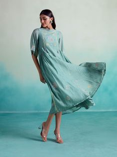 Introducing the enchantmint dress: embrace elegance and grace with this soft, lightweight chanderi dress in a refreshing mint color. Hand-embroidered with intricate motifs inspired by kutichi embroidery, this dress exudes a charming allure. Its flowy and dramatic design, complemented by pleats on the side, guarantees a show-stopping entrance at any gathering. Perfectly suited for get-togethers with loved ones, where delectable food and cherished family moments await. Step into enchantment with t Spring Festive Chanderi Embroidered Dress, Chanderi Floral Embroidered Dress For Eid, Green Kurta With Embroidered Neckline For Eid, Summer Dress With Chikankari Embroidery In Chanderi, Green Embroidered Neckline Straight Kurta Dress, Green Straight Kurta Dress With Embroidered Neckline, Green Straight Kurta With Embroidered Neckline, Festive Straight Kurta Dress With Embroidered Neckline, Summer Anarkali Embroidered Chanderi Dress