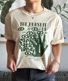 Hand-drawn design by an L&D nurse for fellow healthcare workers--the perfect t-shirt to celebrate the pursuit of compassionate care and champion patient-centered perspectives. This t-shirt also makes for an amazing gift for the medical professional in your life! Check out this design as a crewneck!  https://www.etsy.com/listing/1708950974/compassionate-care-crewneck-crewneck-for?ref=listings_manager_grid T-Shirt Details: - Comfort Colors brand (supports education, the environment, humanitarian aid and active living in the communities they do business with) - Unisex sizing (we recommend choosing 2x your normal size for an oversized fit) - 100% ring spun USA cotton - Preshrunk, soft-washed, garment-dyed fabric If you have any questions or concerns, please do not hesitate to reach out! Thank 2024 Wishlist, Humanitarian Aid, Healthcare Workers, Active Living, Hand Drawn Design, Nursing Shirts, Medical Professionals, Dyed Fabric, Comfort Colors