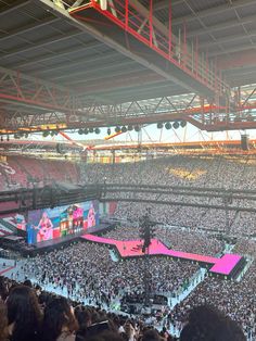 a large crowd at a concert in an arena